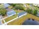 Aerial view of house near pond at 3065 Jon Jon Ct, Orlando, FL 32822