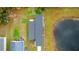 Aerial view of a house near a pond at 3065 Jon Jon Ct, Orlando, FL 32822