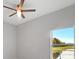 Bright bedroom with a ceiling fan and view of the backyard at 3065 Jon Jon Ct, Orlando, FL 32822