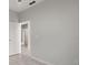 Simple bedroom with neutral walls and tile flooring at 3065 Jon Jon Ct, Orlando, FL 32822