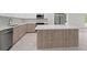 Modern kitchen island with wood grain cabinets at 3065 Jon Jon Ct, Orlando, FL 32822