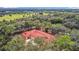 Aerial view of home with red tile roof and large lot, offering serene landscape views at 3141 Oak Alley Dr, Apopka, FL 32703