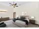 Main bedroom with plush bed, gray carpet, and modern decor at 3141 Oak Alley Dr, Apopka, FL 32703