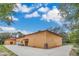 House exterior with three-car garage and expansive backyard at 3141 Oak Alley Dr, Apopka, FL 32703