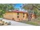 Yellow house with red tile roof and stone accents at 3141 Oak Alley Dr, Apopka, FL 32703