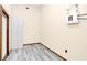 Bright laundry room with white cabinets and vinyl flooring at 3141 Oak Alley Dr, Apopka, FL 32703