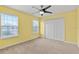 Bright bedroom with neutral walls, ceiling fan, and ample closet space at 3464 Julius Estates Blvd, Winter Haven, FL 33881