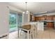 Dining area with sliding doors to backyard and kitchen view at 3464 Julius Estates Blvd, Winter Haven, FL 33881