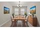 Elegant dining room with wood table and sideboard at 3464 Julius Estates Blvd, Winter Haven, FL 33881