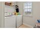 Convenient laundry room with washer, dryer, and shelving at 3464 Julius Estates Blvd, Winter Haven, FL 33881