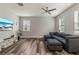 Living area with gray sectional sofa and large TV at 3464 Julius Estates Blvd, Winter Haven, FL 33881