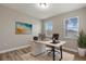 Home office features wood-look floors and large window at 3464 Julius Estates Blvd, Winter Haven, FL 33881