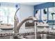 Sleek kitchen sink and faucet with granite countertop at 3540 Sandalwood Isle Way, Ocoee, FL 34761