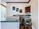 Close up of bar with granite counters, barstool seating and a beverage fridge for entertaining at 38207 Sabal Way, Umatilla, FL 32784