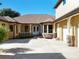 Attractive front exterior view of home featuring an attached garage and mature landscaping at 38207 Sabal Way, Umatilla, FL 32784