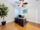 Bright home office featuring a large desk and hardwood flooring at 38207 Sabal Way, Umatilla, FL 32784