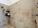 Walk-in shower featuring designer tile, multiple shower heads, and ample space for a relaxing experience at 38207 Sabal Way, Umatilla, FL 32784