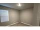 Simple bedroom with neutral walls and carpeted floor at 4476 Lions Gate Ave, Clermont, FL 34711