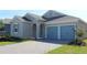 Two-story house with gray siding and a two-car garage at 4476 Lions Gate Ave, Clermont, FL 34711