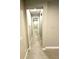 Light-colored hallway with tile flooring at 4476 Lions Gate Ave, Clermont, FL 34711