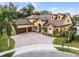 Luxury home on a tree-lined street with a large yard at 4500 Stone Hedge Dr, Orlando, FL 32817