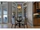 Kitchen breakfast nook with glass table and comfortable seating at 4500 Stone Hedge Dr, Orlando, FL 32817