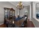 Formal dining room with hardwood floors, a chandelier, and a large table at 4500 Stone Hedge Dr, Orlando, FL 32817