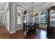 Formal dining room with hardwood floors, a chandelier, and a large table at 4500 Stone Hedge Dr, Orlando, FL 32817