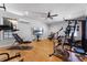 Home gym with various equipment and large TV at 4500 Stone Hedge Dr, Orlando, FL 32817