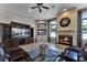 Living room with fireplace, built-in shelving, and comfortable seating at 4500 Stone Hedge Dr, Orlando, FL 32817