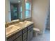 Bathroom with double vanity, granite countertop, and tiled floor at 4586 Se 25Th Loop, Ocala, FL 34480