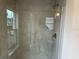 Shower with glass enclosure and neutral tile at 4586 Se 25Th Loop, Ocala, FL 34480