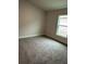 Spacious bedroom with neutral carpeting and window at 4586 Se 25Th Loop, Ocala, FL 34480