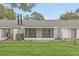 Backyard view of home with screened porch and grassy area at 5132 Lazy Oaks Dr # 5132, Winter Park, FL 32792