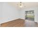 Bedroom with wood-look floors and sliding glass doors to patio at 5132 Lazy Oaks Dr # 5132, Winter Park, FL 32792