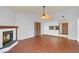 Bright dining area with tile floors, fireplace, and kitchen pass-through at 5132 Lazy Oaks Dr # 5132, Winter Park, FL 32792