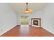 Living room with tile floor, fireplace, and sliding glass doors at 5132 Lazy Oaks Dr # 5132, Winter Park, FL 32792