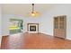 Living room with tile floor, fireplace, and sliding glass doors at 5132 Lazy Oaks Dr # 5132, Winter Park, FL 32792