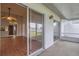 Screened porch with sliding glass doors leading to interior and backyard view at 5132 Lazy Oaks Dr # 5132, Winter Park, FL 32792