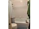 Bathroom features a tub shower and updated flooring at 516 Orange Dr # 26, Altamonte Springs, FL 32701