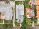 Aerial view showcases the home, patio area, and verdant landscaping in a desirable neighborhood setting at 528 Broadway Ave, Orlando, FL 32803