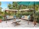 Peaceful backyard patio with two swings and a sitting area at 528 Broadway Ave, Orlando, FL 32803