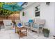 Relaxing backyard patio with seating, umbrella, and small table at 528 Broadway Ave, Orlando, FL 32803