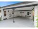 Spacious carport featuring an EV charger with direct access to the home and lush landscaping at 528 Broadway Ave, Orlando, FL 32803