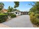 House exterior with carport, landscaping, and spacious driveway at 528 Broadway Ave, Orlando, FL 32803