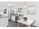 Modern kitchen with stainless steel appliances and white cabinets at 528 Broadway Ave, Orlando, FL 32803