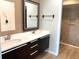 Bathroom with double vanity and large mirror at 5429 Vineland Rd # S, Orlando, FL 32811