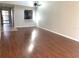 Spacious living room with wood-look floors and high ceilings at 5429 Vineland Rd # S, Orlando, FL 32811