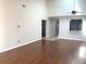 Living room with wood-look floors and high ceilings at 5429 Vineland Rd # S, Orlando, FL 32811