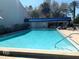 Inviting community swimming pool with lounge chairs at 5429 Vineland Rd # S, Orlando, FL 32811